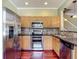 Bright kitchen boasts stainless steel appliances, granite counters and ample storage at 8576 Sandy Beach St, Tampa, FL 33634