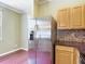 The kitchen features stainless steel appliances and ample cabinet space at 8576 Sandy Beach St, Tampa, FL 33634