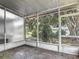 The screened lanai offers views of the water at 8576 Sandy Beach St, Tampa, FL 33634