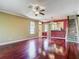 Spacious living room featuring hardwood floors, natural light and open layout at 8576 Sandy Beach St, Tampa, FL 33634