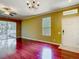 Cozy living room with hardwood floors, lots of light and view of outdoor screened in porch at 8576 Sandy Beach St, Tampa, FL 33634