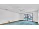 Bright bedroom with sliding glass doors, a ceiling fan and pool views at 8827 Scout Lake Ct, New Port Richey, FL 34654
