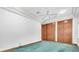 Bright bedroom features carpeted floors and closet space at 8827 Scout Lake Ct, New Port Richey, FL 34654