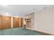 A bedroom with two large closets, a ceiling fan, and built-in desk at 8827 Scout Lake Ct, New Port Richey, FL 34654