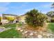 Private yard featuring a screened pool and spa, lush green space, and a stone path at 9408 Sayre St, Riverview, FL 33569