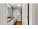 Bathroom featuring granite countertop, vanity, toilet and wood look flooring at 9408 Sayre St, Riverview, FL 33569