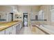 Bathroom features a double sink vanity with stone countertop, large tub, and glass shower enclosure at 9408 Sayre St, Riverview, FL 33569