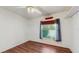 Bedroom with hardwood flooring, ceiling fan, and a window to let in plenty of natural light at 9408 Sayre St, Riverview, FL 33569