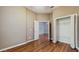 Bedroom featuring neutral paint and wood-look flooring at 9408 Sayre St, Riverview, FL 33569