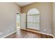 Bright bedroom with hardwood floors, a large window and an ensuite bathroom at 9408 Sayre St, Riverview, FL 33569