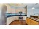 Well-equipped kitchen featuring stainless steel appliances, ample cabinetry, and granite countertops at 9408 Sayre St, Riverview, FL 33569