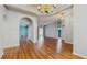 Spacious living room with hardwood floors, stylish lighting fixtures and access to the backyard at 9408 Sayre St, Riverview, FL 33569