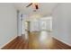 Inviting living room with hardwood floors, arched doorways, and elegant chandeliers at 9408 Sayre St, Riverview, FL 33569