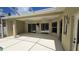 Spacious covered patio area with ceiling fans and sliding glass doors to the backyard pool at 9408 Sayre St, Riverview, FL 33569
