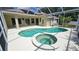 Beautiful backyard pool and jacuzzi surrounded by a screen, plenty of space for outdoor enjoyment at 9408 Sayre St, Riverview, FL 33569