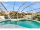 A stunning screened-in pool with a spa offers a relaxing outdoor oasis at 9408 Sayre St, Riverview, FL 33569