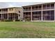 Spacious backyard with lush green grass, ideal for outdoor activities and enjoying nature at 9484 Tara Cay Ct # 8, Seminole, FL 33776