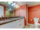 Bathroom with double sinks, granite countertops, and warm lighting at 9484 Tara Cay Ct # 8, Seminole, FL 33776