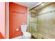 Bathroom with a glass shower and coral colored walls at 9484 Tara Cay Ct # 8, Seminole, FL 33776
