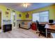 Bright bedroom featuring wood floors, an adjacent bathroom, and a small fireplace at 9484 Tara Cay Ct # 8, Seminole, FL 33776