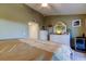 Well-lit bedroom includes dresser and an opening to the outdoor patio at 9484 Tara Cay Ct # 8, Seminole, FL 33776