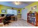 Bright bedroom featuring wood floors, a ceiling fan, and a large closet at 9484 Tara Cay Ct # 8, Seminole, FL 33776