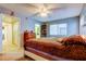 Bedroom with neutral walls and white furniture at 9484 Tara Cay Ct # 8, Seminole, FL 33776