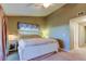 A well-lit bedroom with a view into a corridor and simple decor at 9484 Tara Cay Ct # 8, Seminole, FL 33776
