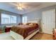 Bedroom with neutral walls and white furniture at 9484 Tara Cay Ct # 8, Seminole, FL 33776