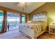The main bedroom features a king bed and access to the screened patio at 9484 Tara Cay Ct # 8, Seminole, FL 33776