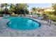 The community pool with lots of places to lounge at 9484 Tara Cay Ct # 8, Seminole, FL 33776