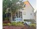 Beautiful two-story home with mature landscaping and the Tara Cay sign out front at 9484 Tara Cay Ct # 8, Seminole, FL 33776