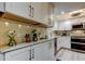 This well-equipped kitchen features modern appliances, ample counter space, and stylish white cabinets at 9484 Tara Cay Ct # 8, Seminole, FL 33776