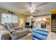 Relax in this cozy living room with an open layout, leading into a bright kitchen and dining area at 9484 Tara Cay Ct # 8, Seminole, FL 33776