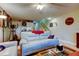 Comfortable living room with sports decor, wet bar, and staircase at 9484 Tara Cay Ct # 8, Seminole, FL 33776