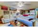 Inviting living room with sports-themed decor, comfortable seating, and fan at 9484 Tara Cay Ct # 8, Seminole, FL 33776