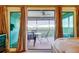 Covered patio with seating for four and a view of the city skyline at 9484 Tara Cay Ct # 8, Seminole, FL 33776