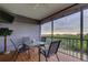 Charming covered patio with comfortable seating and stunning views at 9484 Tara Cay Ct # 8, Seminole, FL 33776