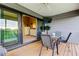 Covered patio with seating and access to the bedroom at 9484 Tara Cay Ct # 8, Seminole, FL 33776