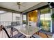 Covered patio with seating and open access to the home's interior at 9484 Tara Cay Ct # 8, Seminole, FL 33776