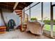 Outdoor screened porch with a spiral staircase, a grill, and a view of the landscape at 9484 Tara Cay Ct # 8, Seminole, FL 33776