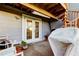 Covered back patio with a spiral staircase, potted plants, and outdoor furniture at 9484 Tara Cay Ct # 8, Seminole, FL 33776