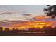 Spectacular sunset view overlooking the water and nearby community at 9484 Tara Cay Ct # 8, Seminole, FL 33776