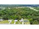 Aerial view of a neighborhood featuring lush greenery, well-maintained homes, and easy access to the highway at 1005 Monroe St, Plant City, FL 33565