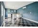 Well-lit bonus room featuring a work space, with an air conditioning unit and durable floors, ideal for a workshop at 1005 Monroe St, Plant City, FL 33565