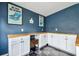 Spacious bonus room with built-in cabinets and a butcher block countertop, perfect for projects and organization at 1005 Monroe St, Plant City, FL 33565
