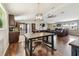 Open floor plan featuring an industrial table, kitchen with stainless steel appliances and a comfortable living room at 1005 Monroe St, Plant City, FL 33565
