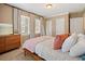 Bedroom showcasing natural light, warm walls, and a dresser at 1013 N Bask Dr, Tampa, FL 33603