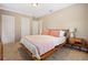 Comfortable bedroom with neutral walls, and a wooden bed frame at 1013 N Bask Dr, Tampa, FL 33603