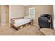 Functional bedroom with a desk, and a cozy single bed by the window at 1013 N Bask Dr, Tampa, FL 33603